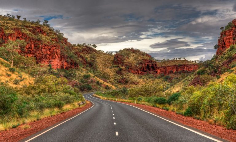 Winding road through red rock gorge landscape